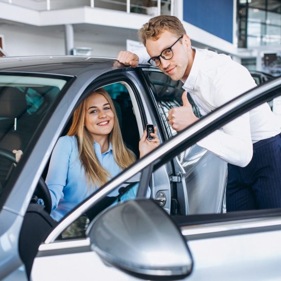 Young woman testing a car from a car showroom